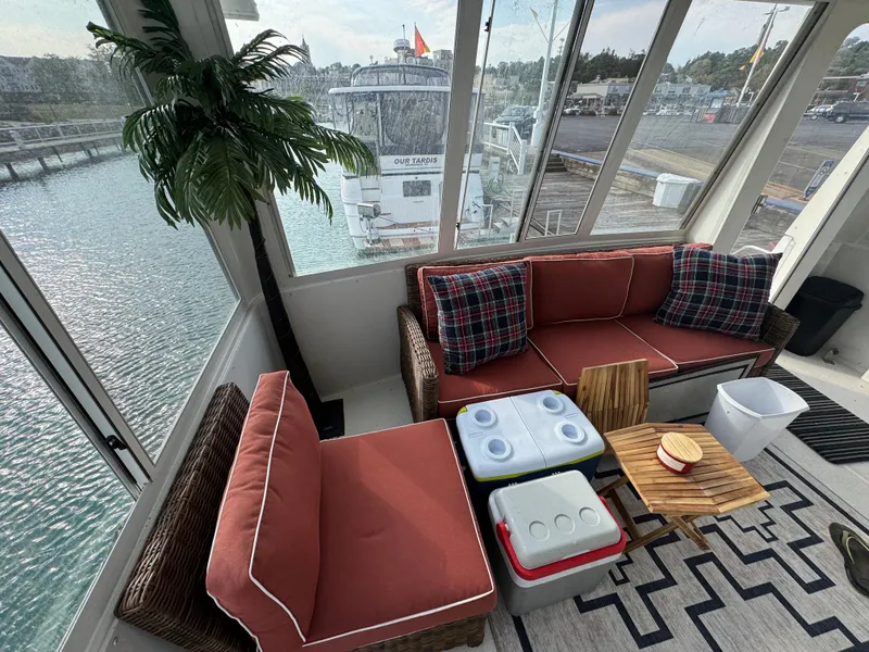 Slide: The Image of Cozy seating area on 2000 Carver 504 Cockpit Motor Yacht with water view. - 16