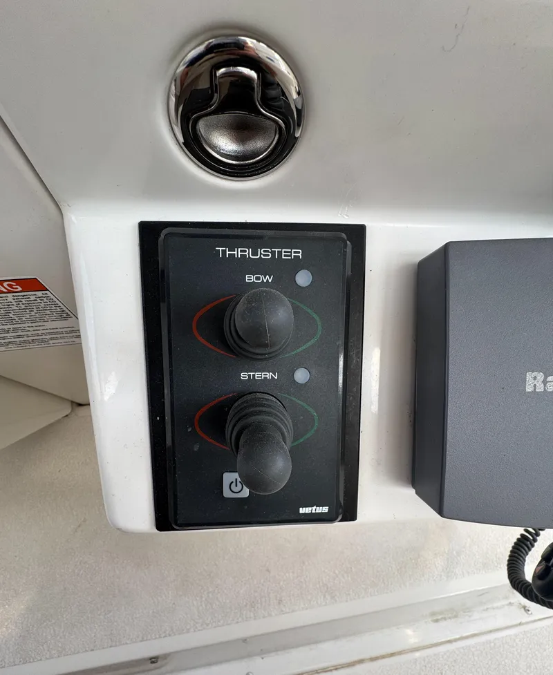Slide: The Image of Control panel of a 2000 Carver 504 Cockpit Motor Yacht, featuring bow and stern thruster controls. - 21
