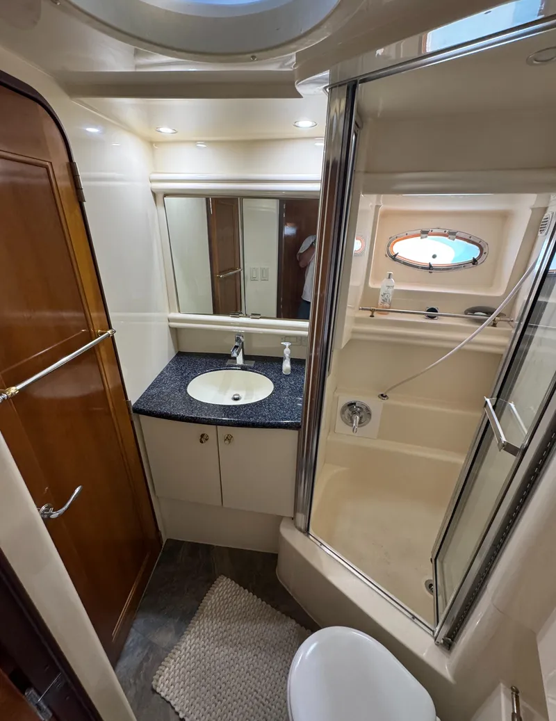 Slide: The Image of Bathroom interior of 2000 Carver 504 Cockpit Motor Yacht, featuring sink and shower. - 33