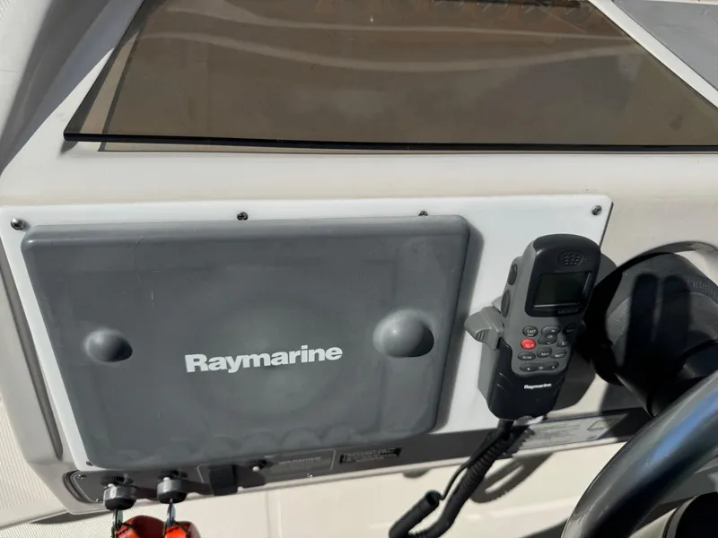 Slide: The Image of Control panel of a 1994 Regal 322 Commodore with Raymarine equipment. - 11