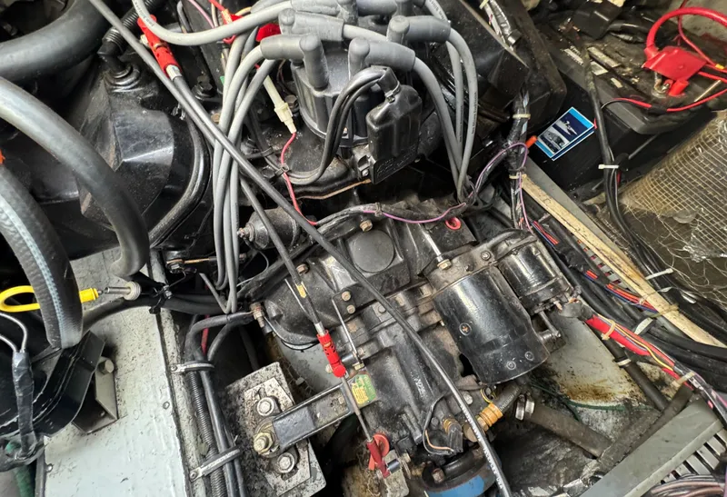 Slide: The Image of Engine compartment of a 1994 Regal 322 Commodore boat, showing wiring and components. - 31