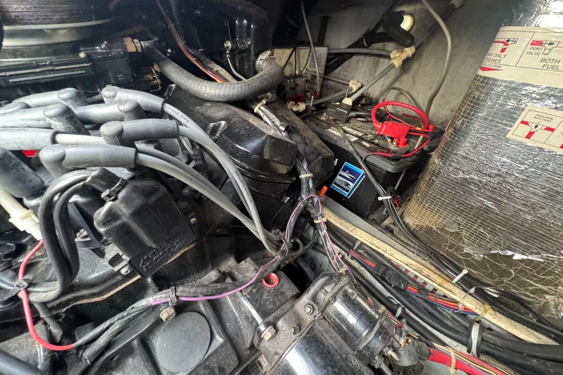 Slide: The Image of Engine compartment of a 1994 Regal 322 Commodore boat, showing wiring and components. - 32