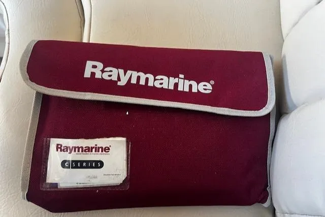 Slide: The Image of Red Raymarine C Series pouch on Regal 322 Commodore 1994 boat seat. - 33