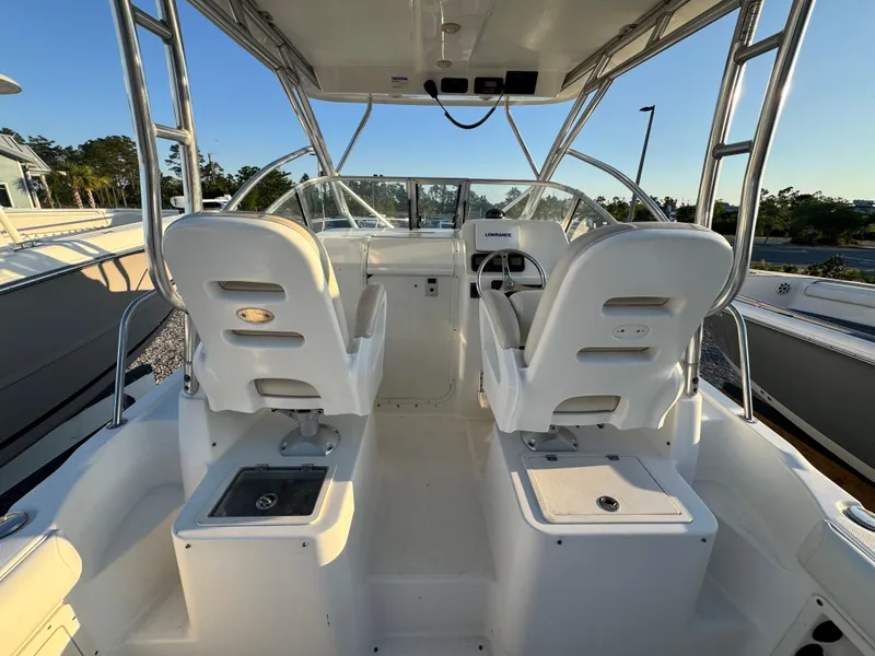 Slide: The Image of 2008 Century 2400 Walkaround boat interior with dual seats and steering console. - 11