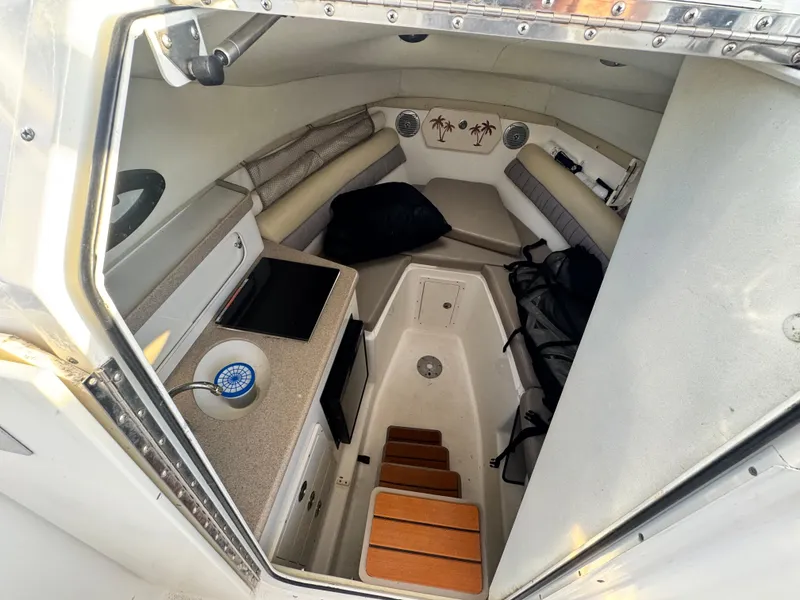 Slide: The Image of 2008 Century 2400 Walkaround cabin interior with seating and storage. - 16