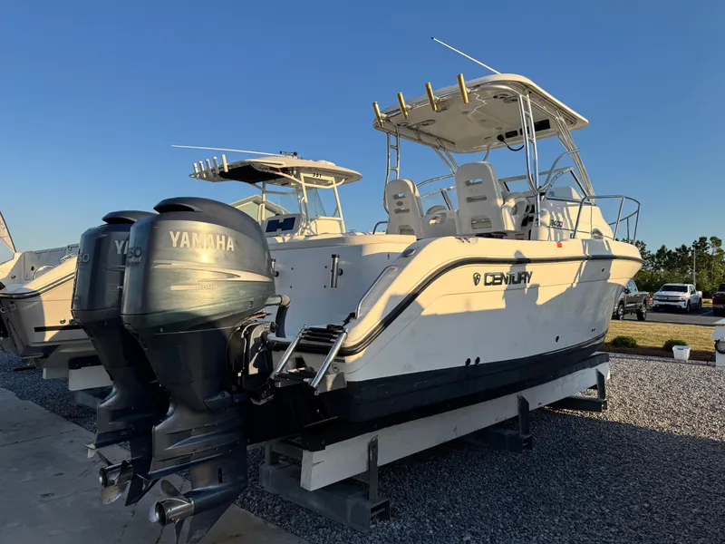 Slide: The Image of 2008 Century 2400 Walkaround boat with Yamaha engines on display outdoors. - 5