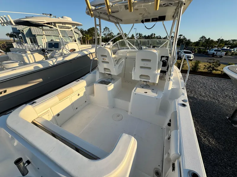 Slide: The Image of 2008 Century 2400 Walkaround boat with spacious deck and seating, ideal for fishing trips. - 9
