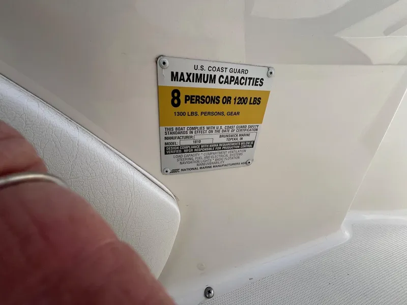 Slide: The Image of 1997 Starcraft 1810 boat capacity label, maximum 8 persons or 1200 lbs. - 12