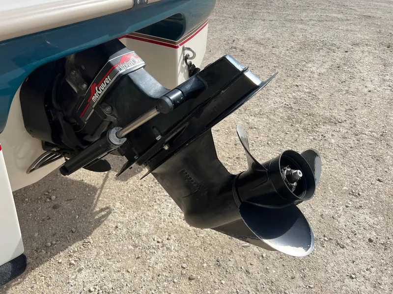 Slide: The Image of 1997 Starcraft 1810 boat with MerCruiser Alpha One outdrive on gravel surface. - 5