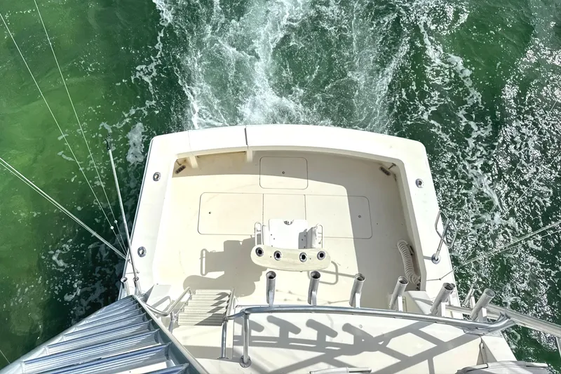 Slide: The Image of Aerial view of 1990 Viking 38 Convertible boat deck on water. - 34