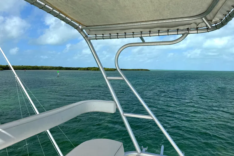 Slide: The Image of View from a 1990 Viking 38 Convertible boat overlooking calm ocean waters. - 42