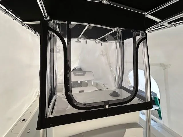 Slide: The Image of 2024 Parker 1801 Center Console boat interior with protective enclosure and seating. - 11