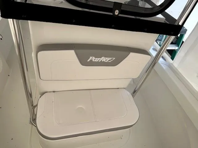 Slide: The Image of 2024 Parker 1801 Center Console boat seat with logo, featuring sleek white design. - 14