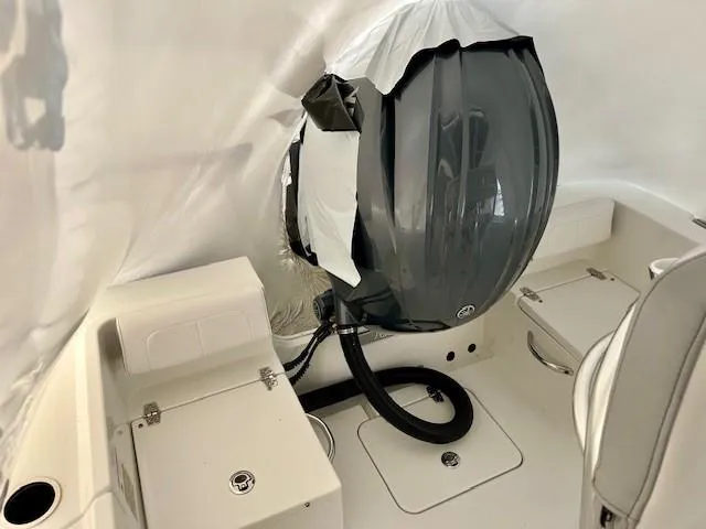 Slide: The Image of 2024 Parker 1801 Center Console boat interior with covered engine. - 17