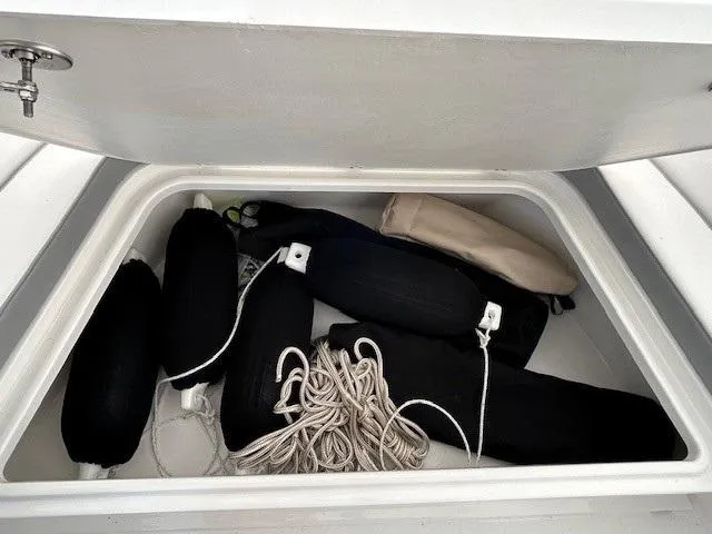 Slide: The Image of Storage compartment on 2024 Parker 1801 Center Console with ropes and fenders. - 5