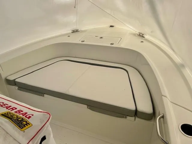 Slide: The Image of 2024 Parker 1801 Center Console boat interior with cushioned seating and storage. - 6