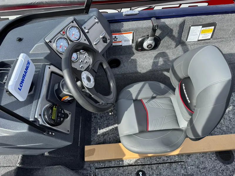 Slide: The Image of 2025 Tracker Pro Guide V-175 Combo boat cockpit with steering wheel and gauges. - 12