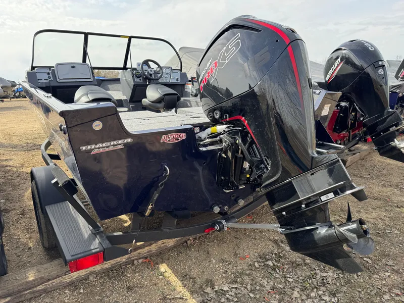 Slide: The Image of 2025 Tracker Pro Guide V-175 Combo boat on trailer, featuring powerful outboard motor. - 2