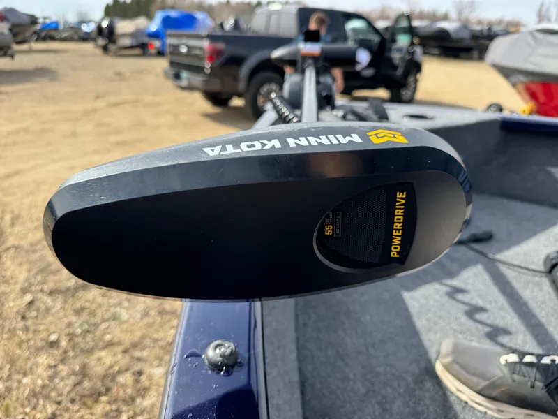 Slide: The Image of 2025 Tracker Pro Guide V-175 Combo with Minn Kota PowerDrive motor in outdoor setting. - 5