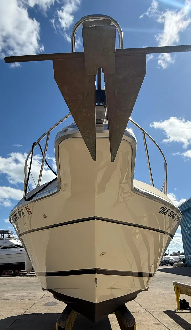 Slide: The Image of 1992 Century Antigua 235 boat on display under a bright blue sky. - 1