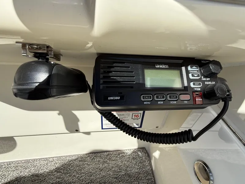 Slide: The Image of VHF radio installed on a 1992 Century Antigua 235 boat dashboard. - 12