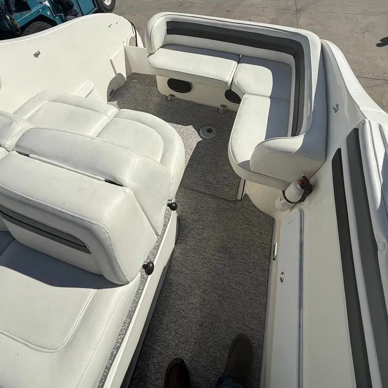 Slide: The Image of 1992 Century Antigua 235 boat interior with white seating and gray accents. - 13