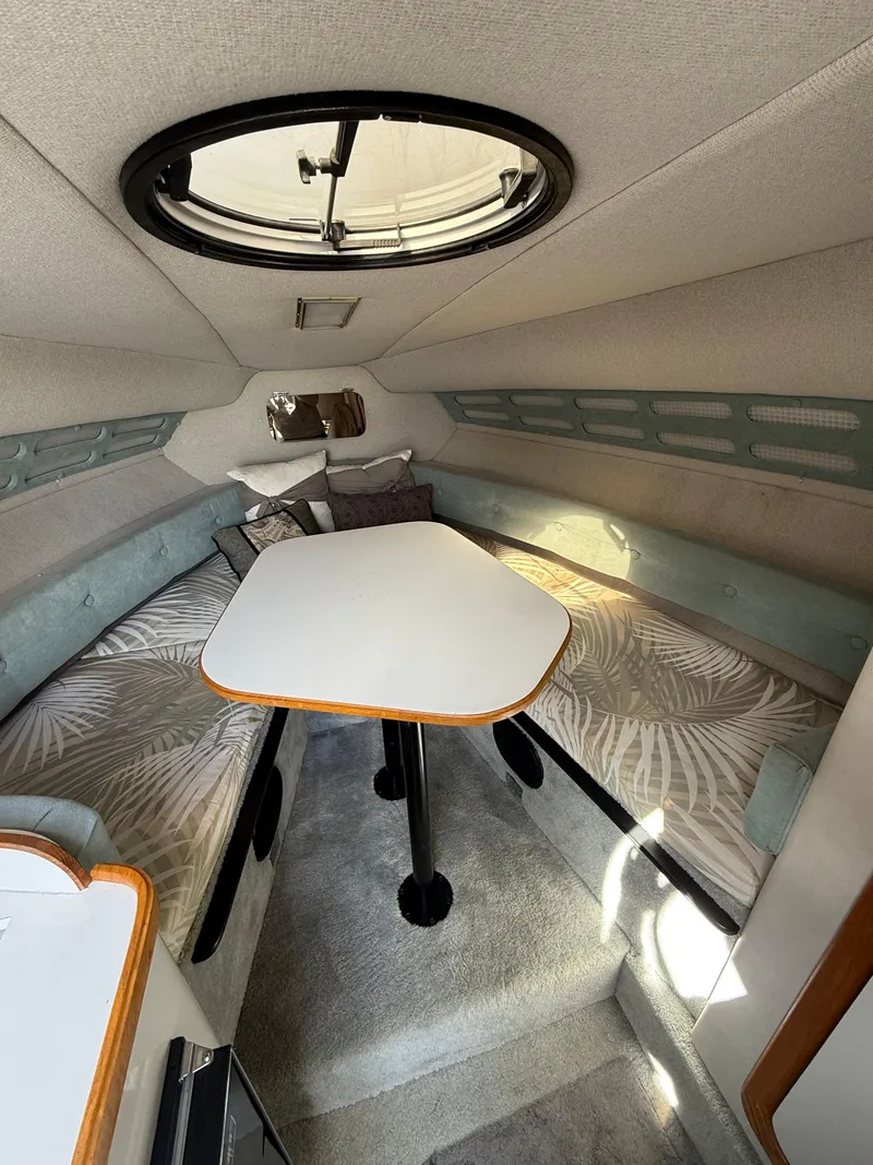 Slide: The Image of Interior of a 1992 Century Antigua 235 boat with seating and table. - 14