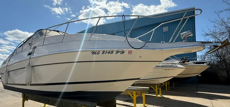 Slide: The Image of 1992 Century Antigua 235 boat on display under a clear blue sky. - 2
