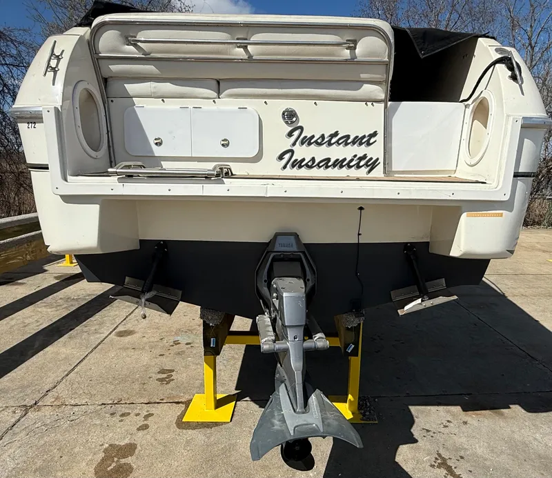 Slide: The Image of 1992 Century Antigua 235 boat named "Instant Insanity" on yellow stands, rear view. - 4