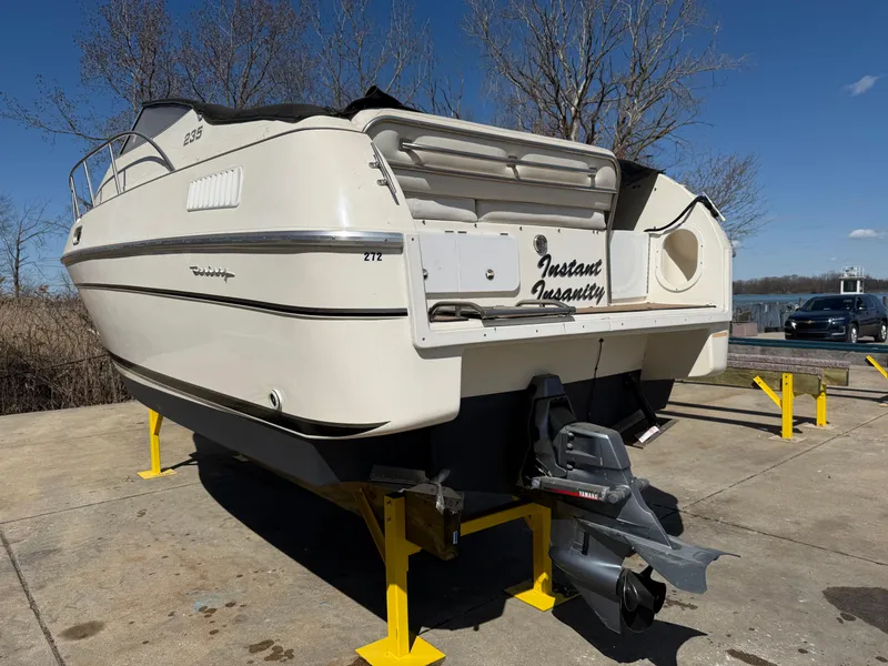 Slide: The Image of 1992 Century Antigua 235 boat on stands, rear view, outdoors. - 5