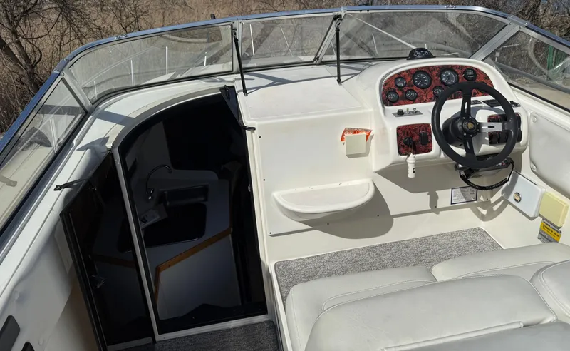 Slide: The Image of 1992 Century Antigua 235 boat interior with steering wheel and dashboard. - 8