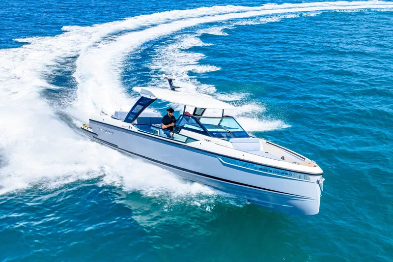 Slide: The Image of Saxdor 320 GTO 2026 cruising on open sea, dynamic motion. - 19