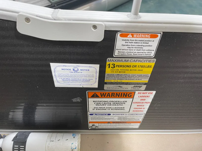 Slide: The Image of Safety and capacity warnings on a 2016 Bennington 22SX boat. - 17