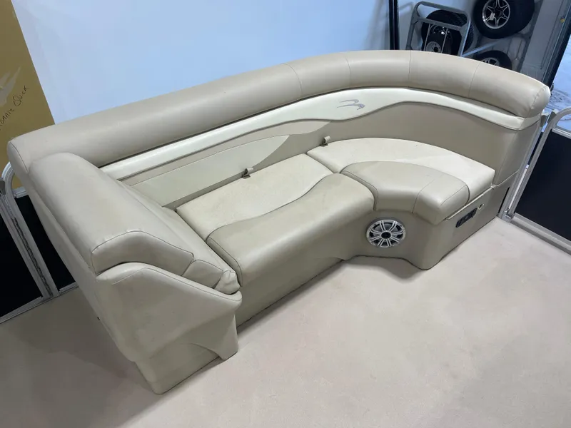 Slide: The Image of Beige seating on 2016 Bennington 22SX boat, featuring integrated speaker and armrest. - 20