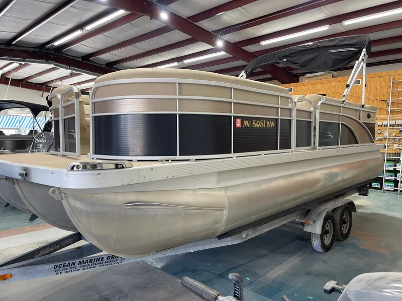 Slide: The Image of 2016 Bennington 22SX pontoon boat on trailer in indoor storage facility. - 6