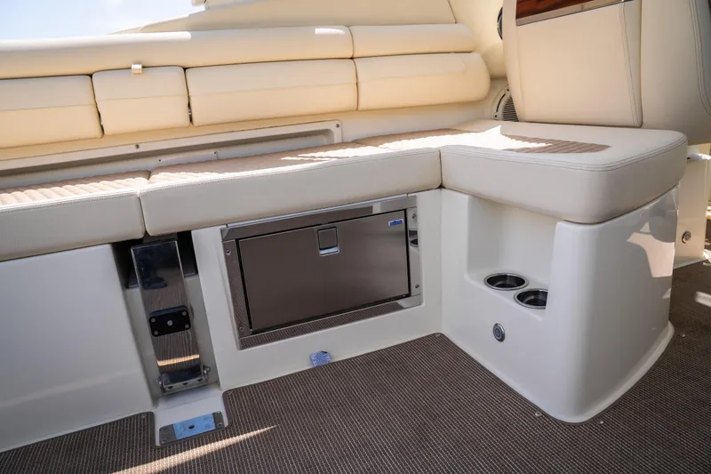 Slide: The Image of 2024 Chris-Craft Launch 35 GT interior seating with built-in storage and cup holders. - 15