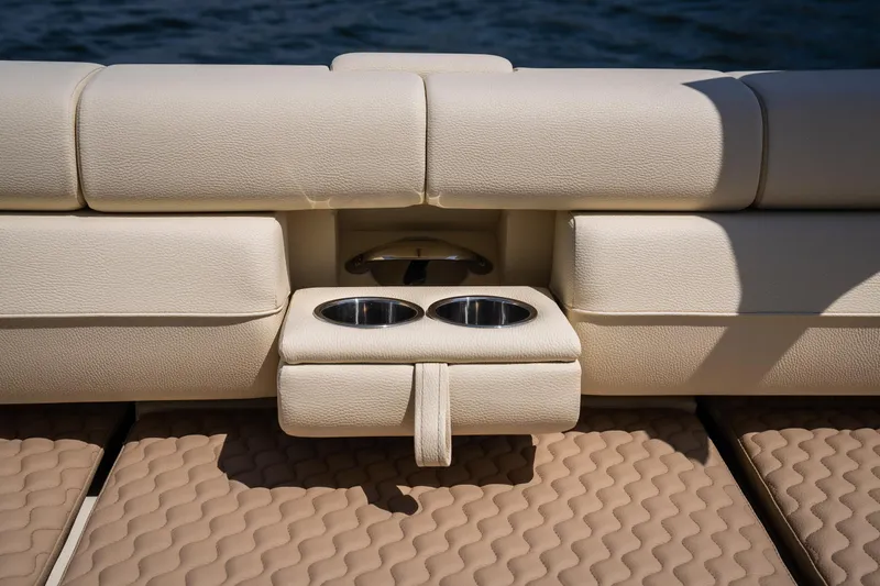 Slide: The Image of 2024 Chris-Craft Launch 35 GT boat interior with beige seating and cup holders. - 17