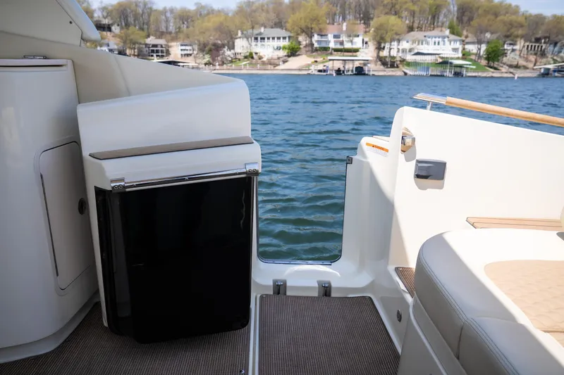 Slide: The Image of 2024 Chris-Craft Launch 35 GT boat interior with lake view and seating area. - 18