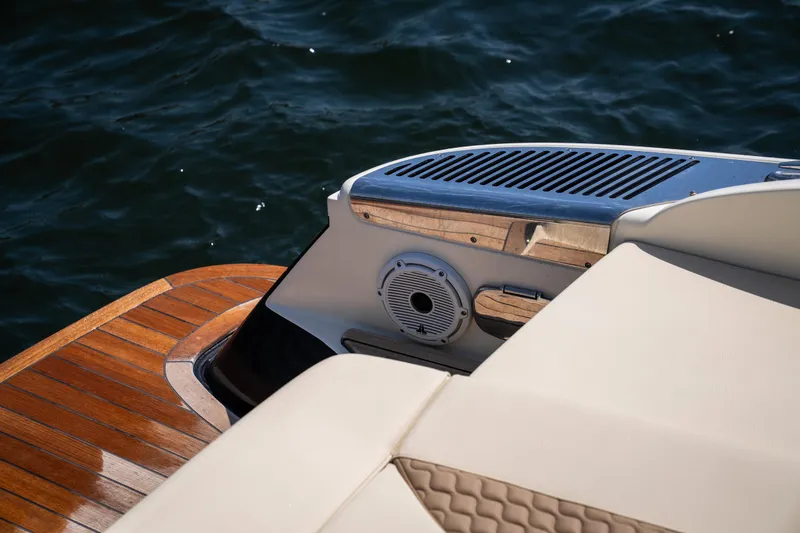 Slide: The Image of 2024 Chris-Craft Launch 35 GT boat, featuring elegant teak decking and luxurious seating. - 21