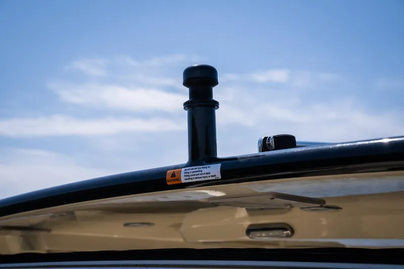 Slide: The Image of 2024 Chris-Craft Launch 35 GT boat detail against blue sky. - 23