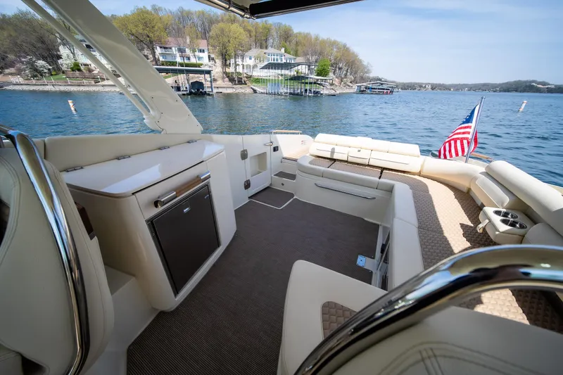 Slide: The Image of 2024 Chris-Craft Launch 35 GT interior with luxurious seating and lake view. - 45