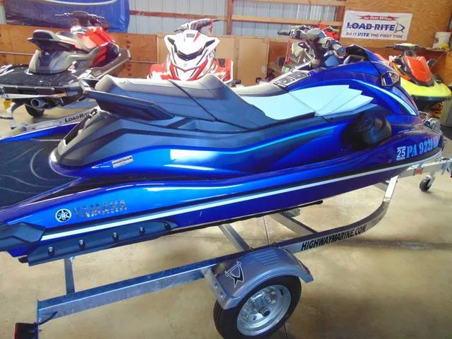 Slide: The Image of 2024 Yamaha Waverunner GP SVHO with Audio, blue, on trailer in showroom. - 3