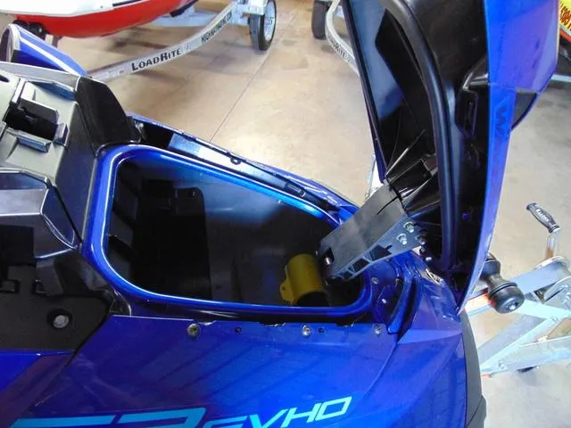 Slide: The Image of 2024 Yamaha Waverunner GP SVHO with Audio, open storage compartment, blue exterior. - 8