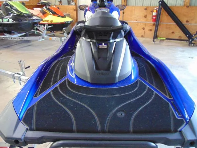 Slide: The Image of 2024 Yamaha Waverunner GP SVHO with Audio, blue, rear view in a showroom. - 9