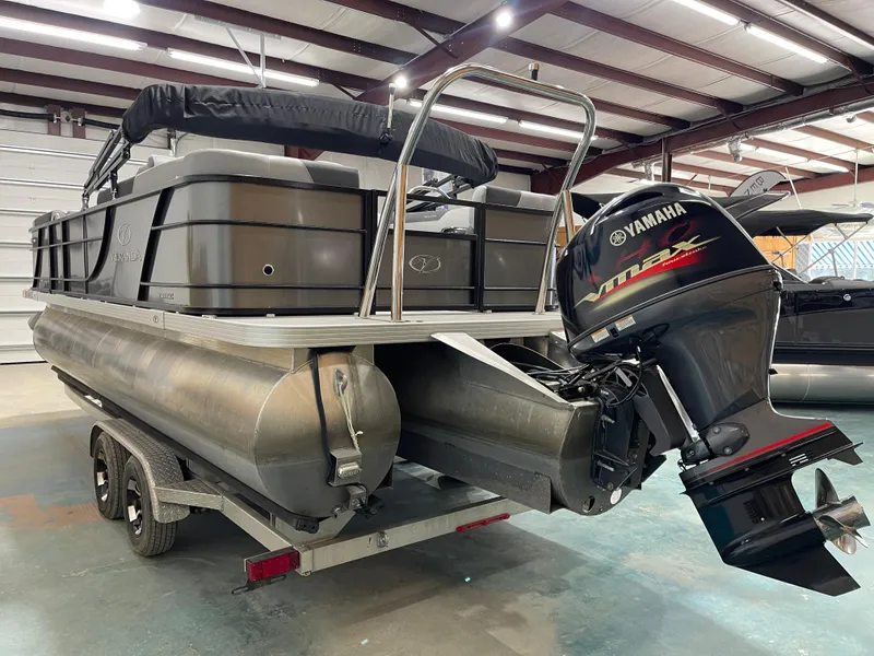 Slide: The Image of 2021 Veranda VR22RC pontoon boat with Yamaha outboard motor in a warehouse setting. - 10