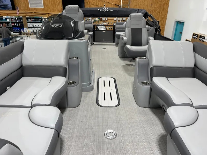 Slide: The Image of 2021 Veranda VR22RC pontoon boat interior with gray seating and modern design. - 12