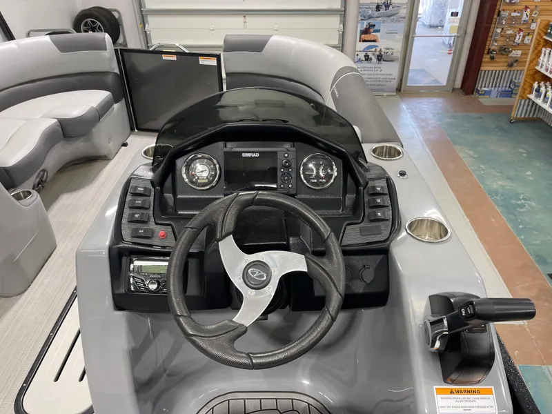 Slide: The Image of Veranda VR22RC 2021 boat dashboard with steering wheel and control panel in showroom. - 14