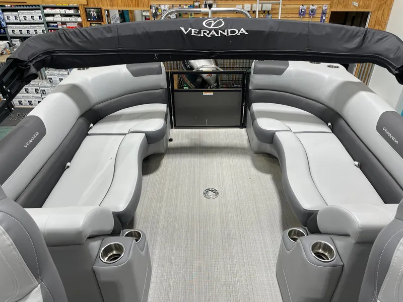 Slide: The Image of 2021 Veranda VR22RC pontoon boat interior with gray seating and cup holders. - 17