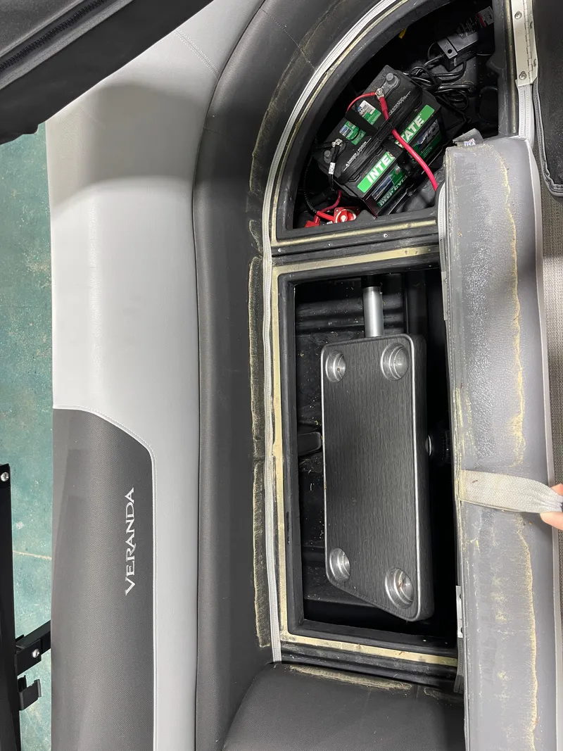 Slide: The Image of Veranda VR22RC 2021 boat interior showing battery compartment and seating area. - 18