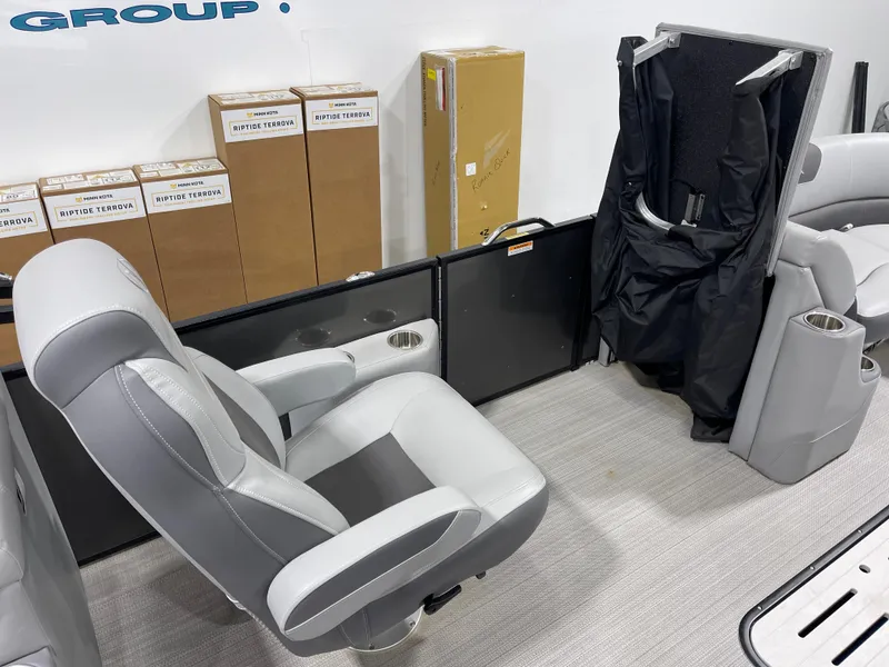 Slide: The Image of 2021 Veranda VR22RC boat interior with gray seating and storage boxes. - 20